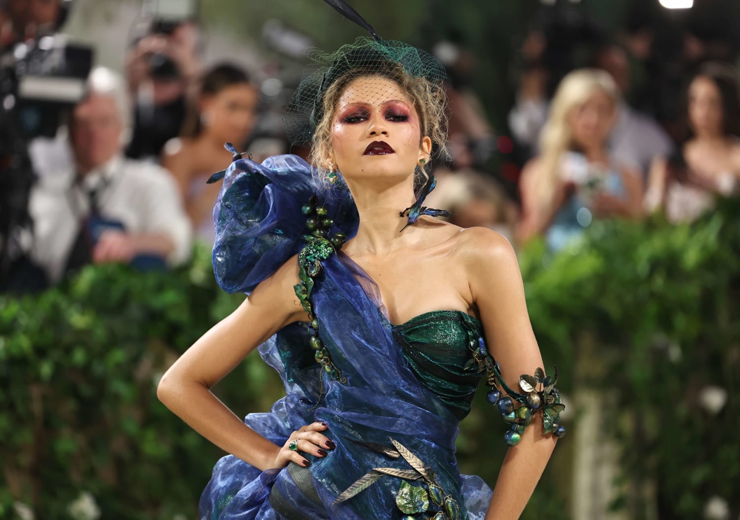 Former supermodel walks runway in 110-pound couture gown
