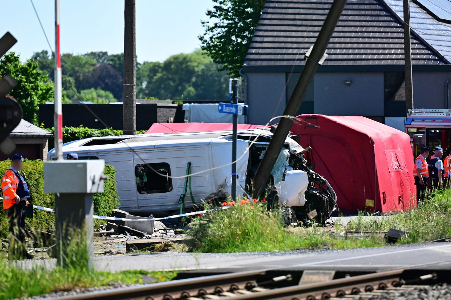 Train hits school minibus in Belgium, killing four, including pupils