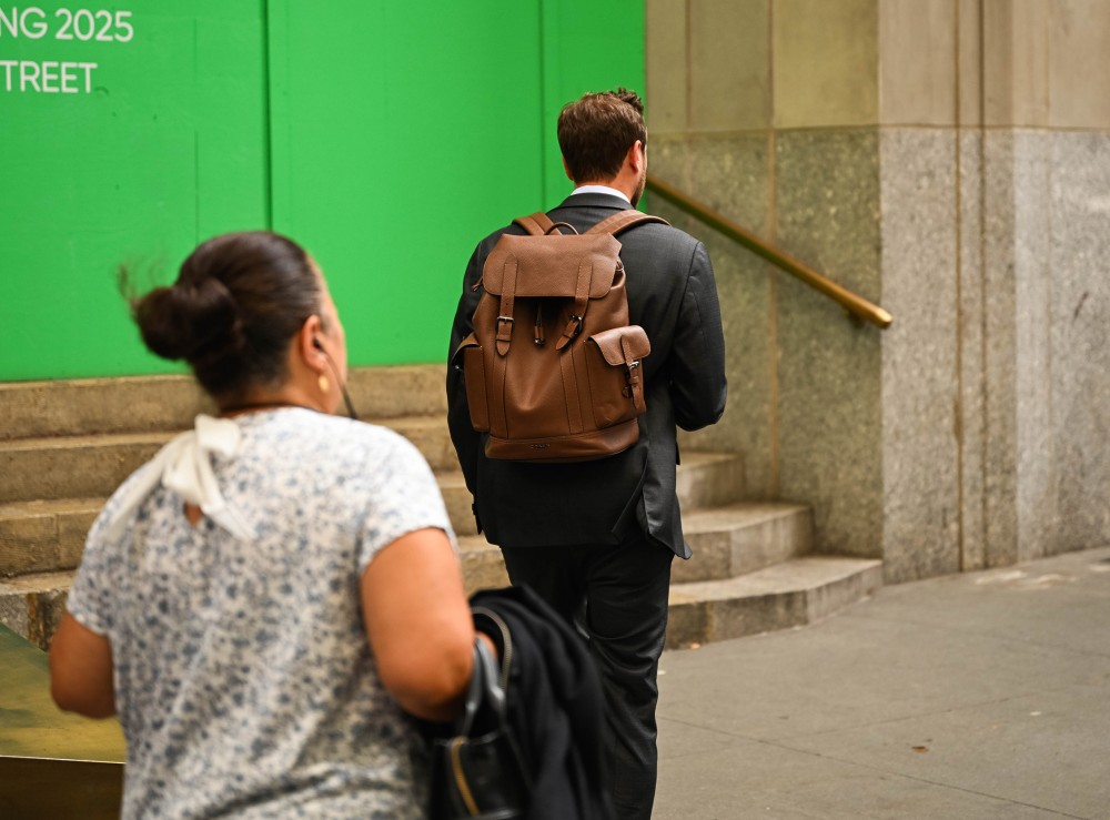 A man walking in the Financial District of New York on June 24, 2024.