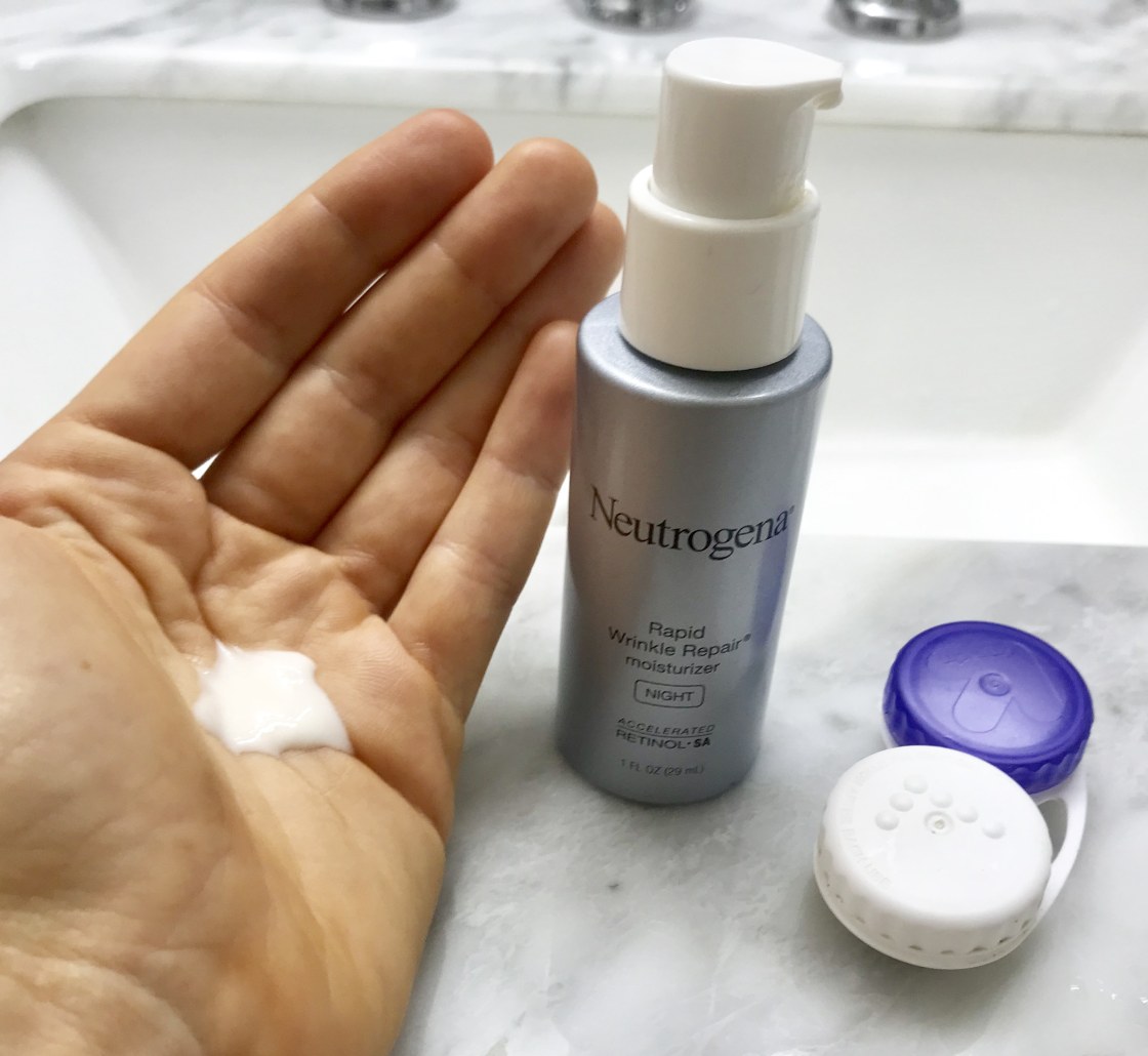 Neutrogena Rapid Wrinkle Repair Night Moisturizer in my hand and next to contact lens case