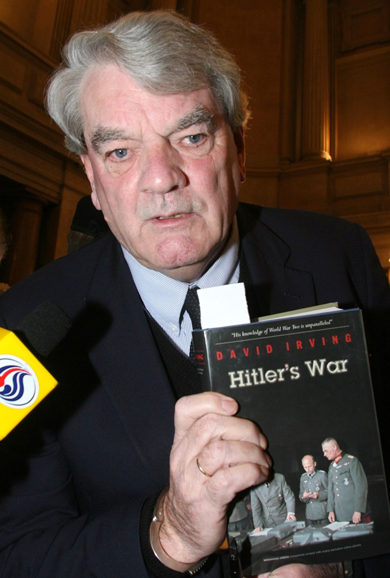  Image 2 of Historical Revisionism Article Author and Holocaust denier David Irving holding a copy of his controversial book 