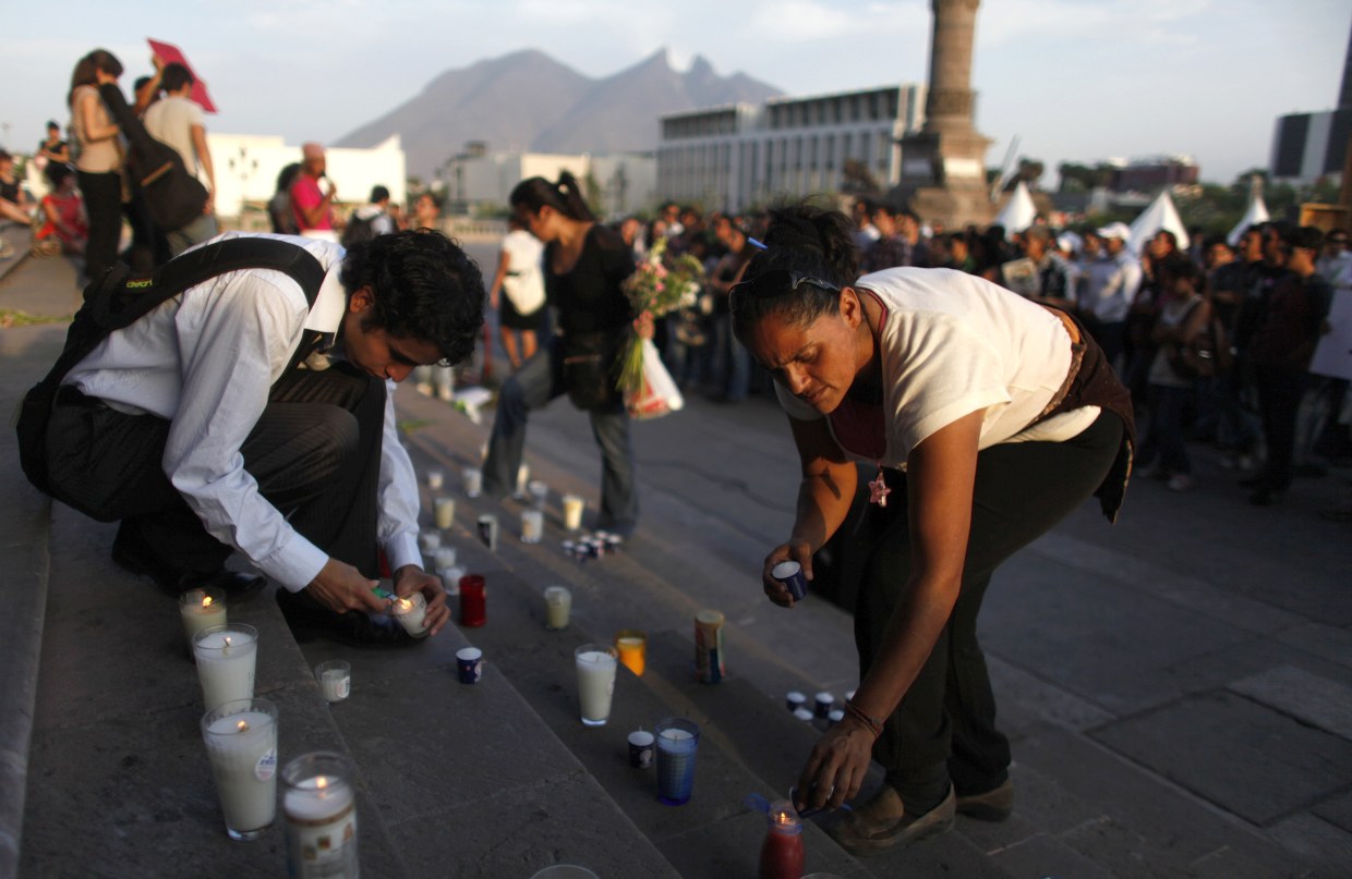 Image: Residents light up candles during a protest in Monterrey, Mexico.