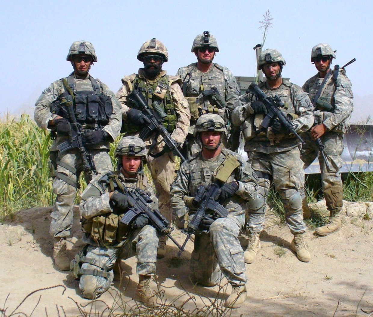 This is a photo of Lt.Col. Harjit Singh Sajjan of the Canadian army in a group with U.S. soldiers before they embarked on a strategic mission. He was deployed to Afghanistan thrice, the third time at the request of Gen.James Terry of the U.S. army, who was the commander of the 10th Mountain Division stationed in Afghanistan at that time. Col.Sajjan served as "Special Adviser" to Gen.Terry. He was a vital part of some strategic missions carried out by the U.S. army in Kandahar, and other areas heavily controlled by the Taliban. In addition to serving as "Special Adviser" to Gen.James Terry, he also served as Special Adviser to another U.S. govt. representative in Kandahar.