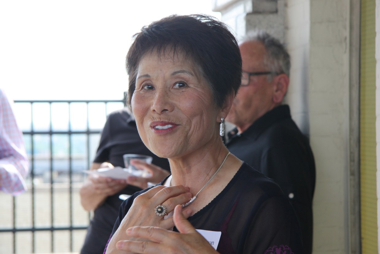 Dr. Sook Wilkinson, Co-Editor with Victor Jew of “Asian Americans in Michigan—Voices from the Midwest” and former chair of the Michigan Asian Pacific American Affairs Commission, at the Wayne State University Press book launch party last week in Detroit with book cover