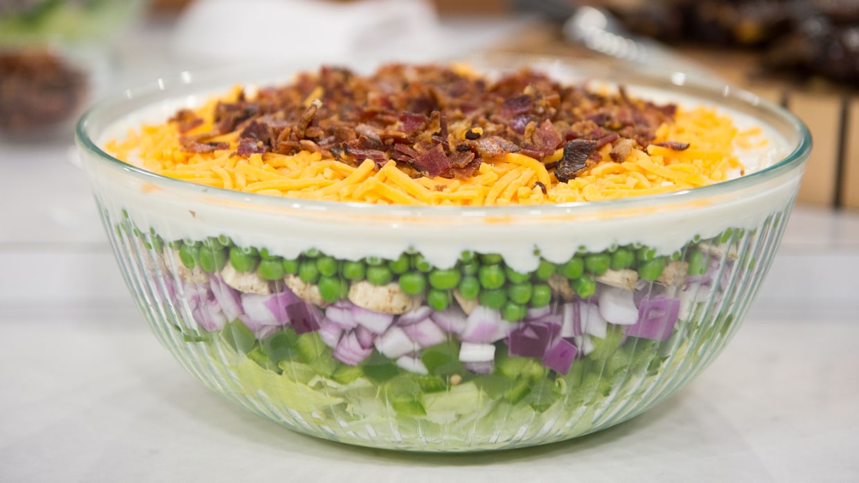 Layered salad in plastic cups. Perfect for picnics