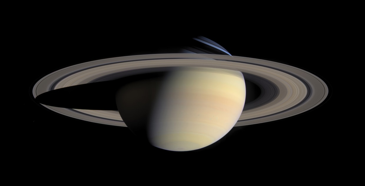 Saturn is overexposed in this image taken by NASA's Cassini spacecraft in  order to show the dim rings. Pandora (below rings to the left) has been  brightened by a factor of 1.3
