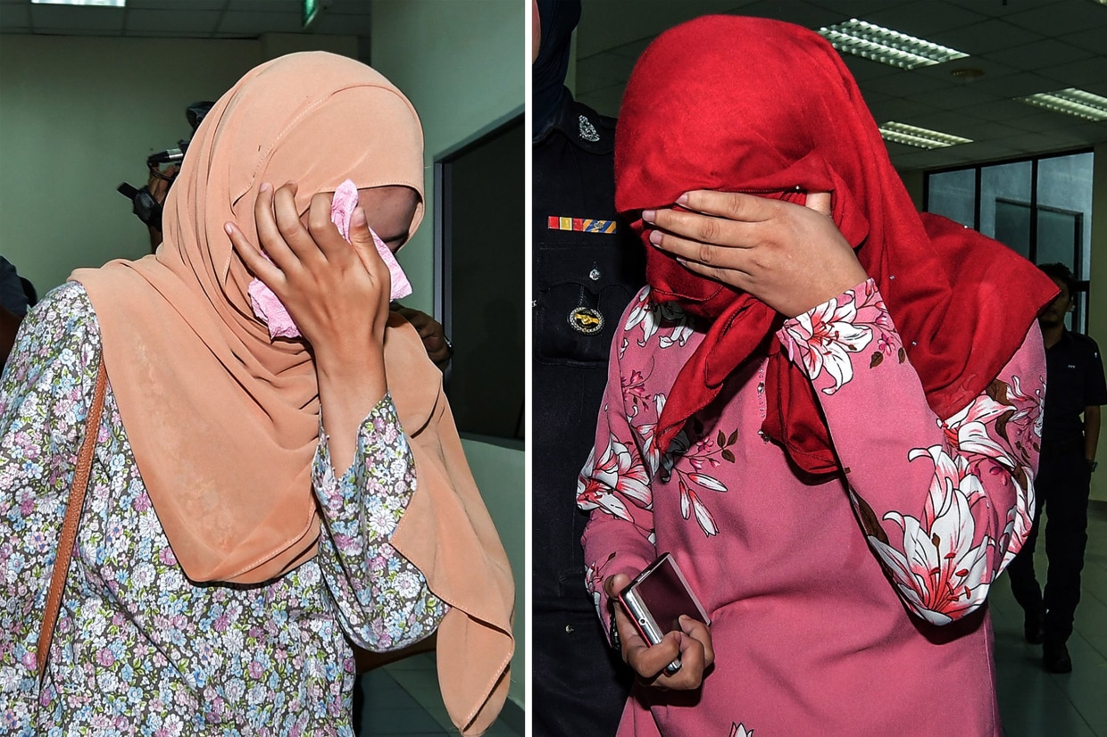 Malaysian Muslim lesbian couple caned in public punishment photo pic