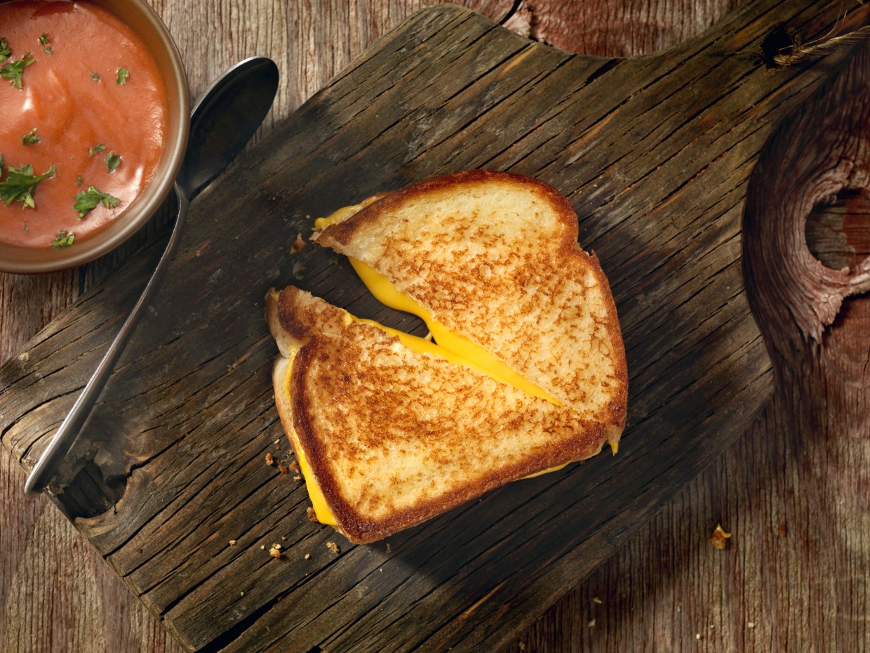 Grilled cheese sandwich being grilled in frying pan Stock Photo