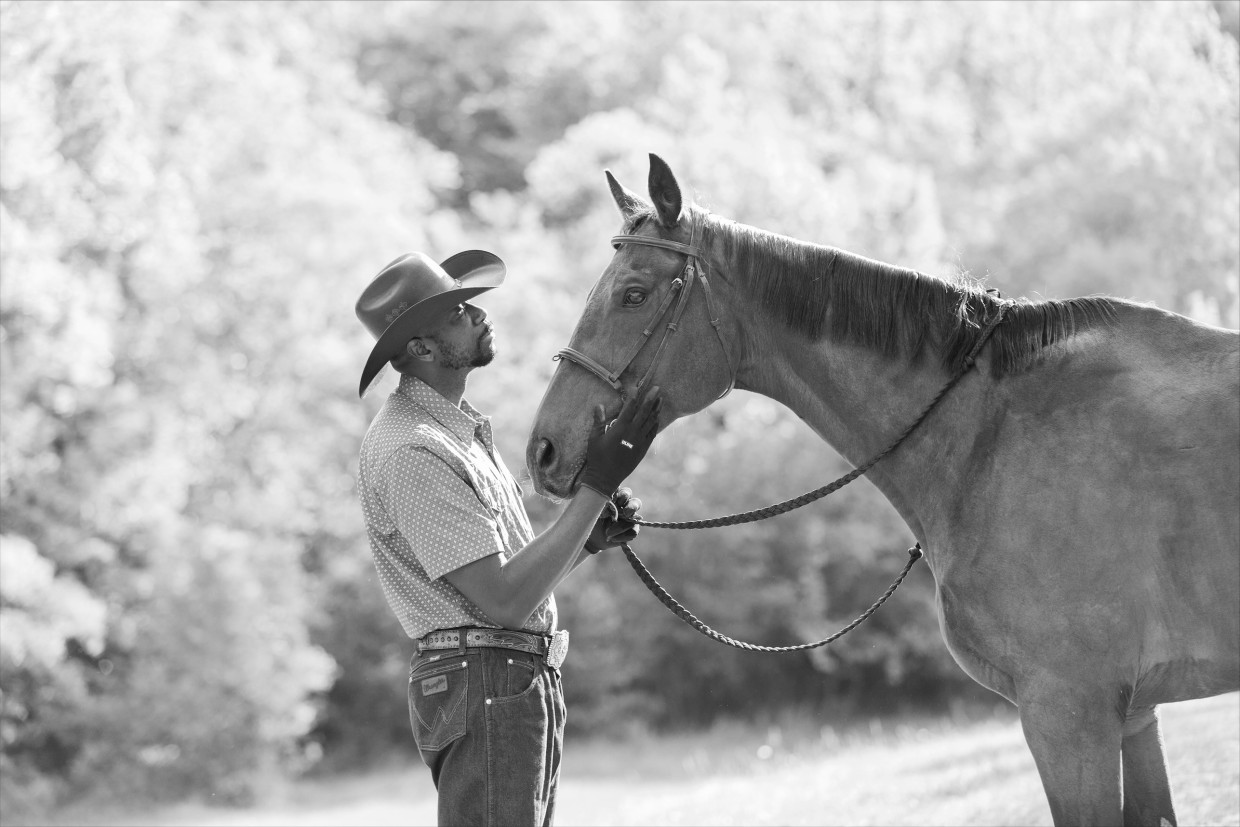 Black horse trainers offer horseback riding as therapy