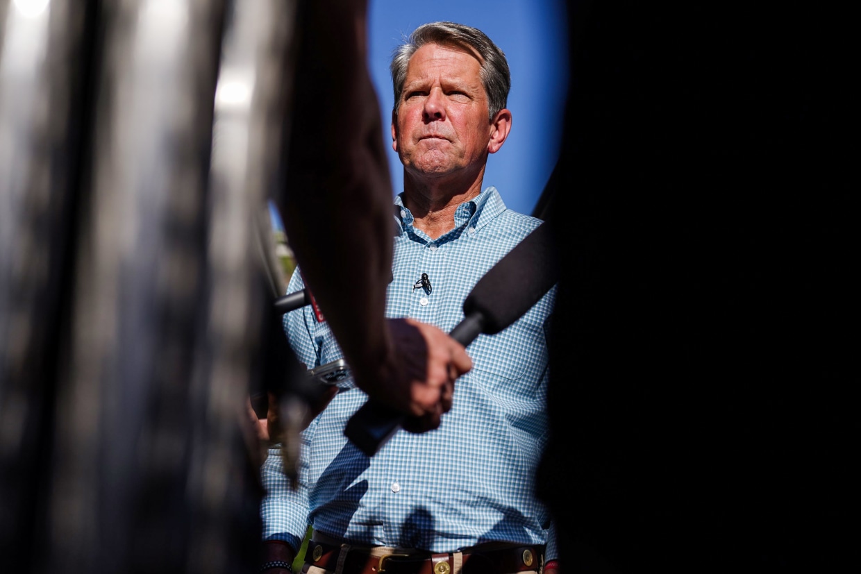 Georgia Gov. Brian Kemp speaks to the media following a campaign event on May 17, 2022, in Alpharetta.