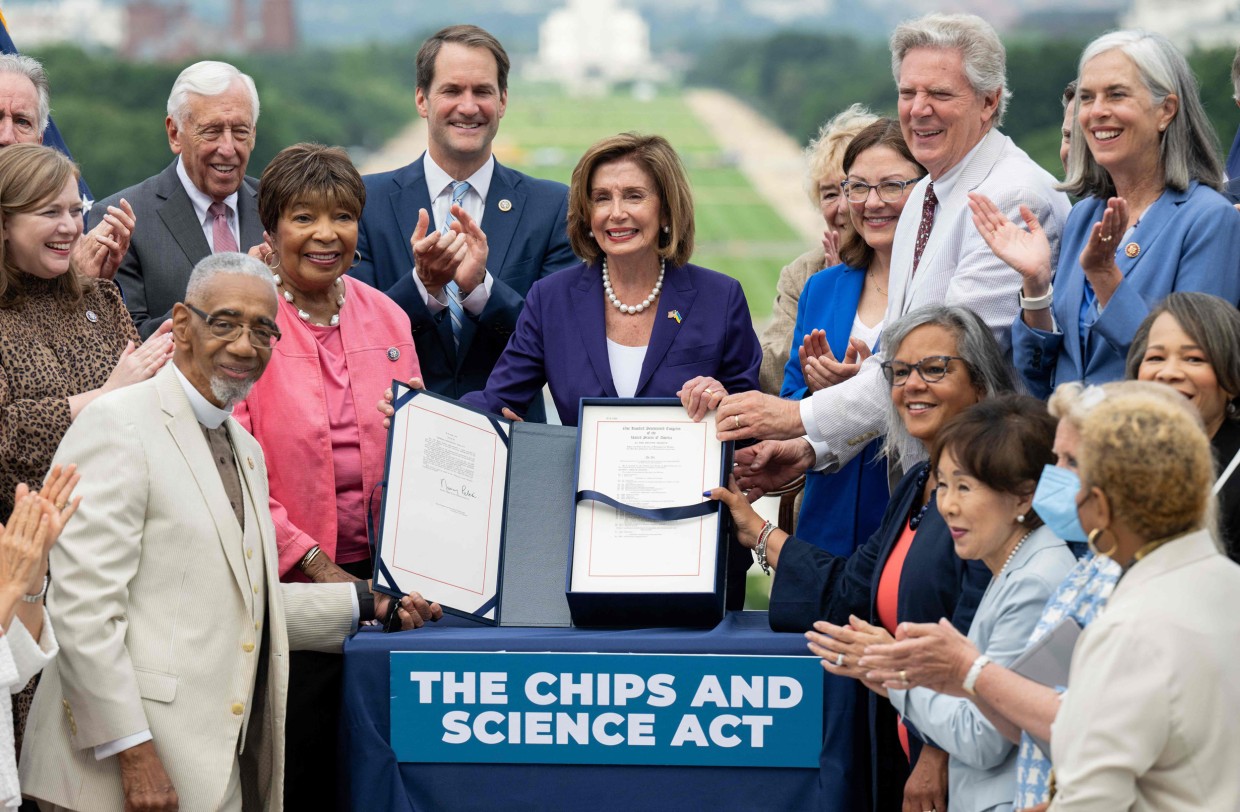 Speaker of the House Nancy Pelosi stands among members of Congress