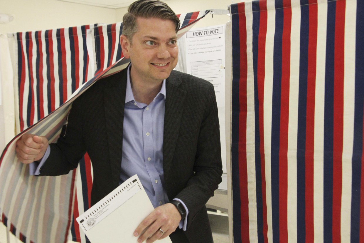Nick Begich, a Republican candidate in both the special election and regular primary for Alaska's open U.S. House seat, emerges from a booth after voting on Aug. 10, 2022, in Anchorage.