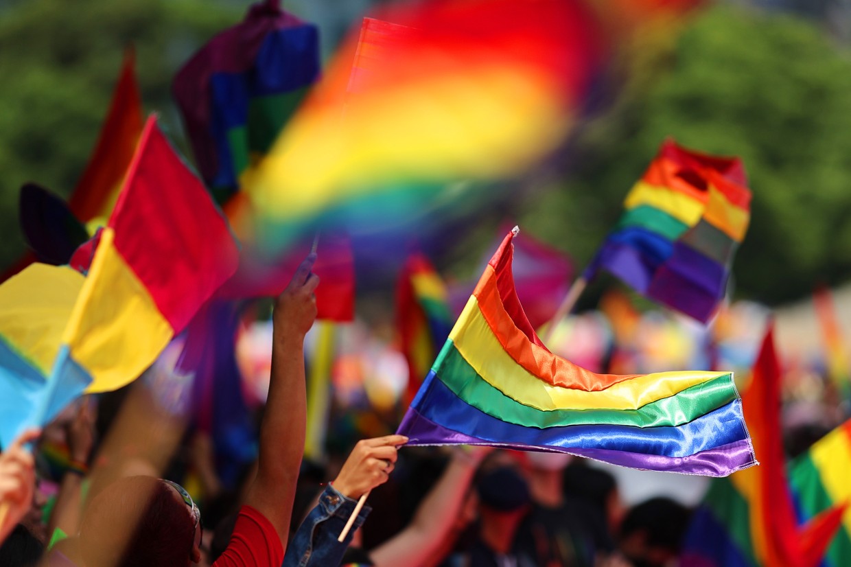 People wave pride flags in Mexico City