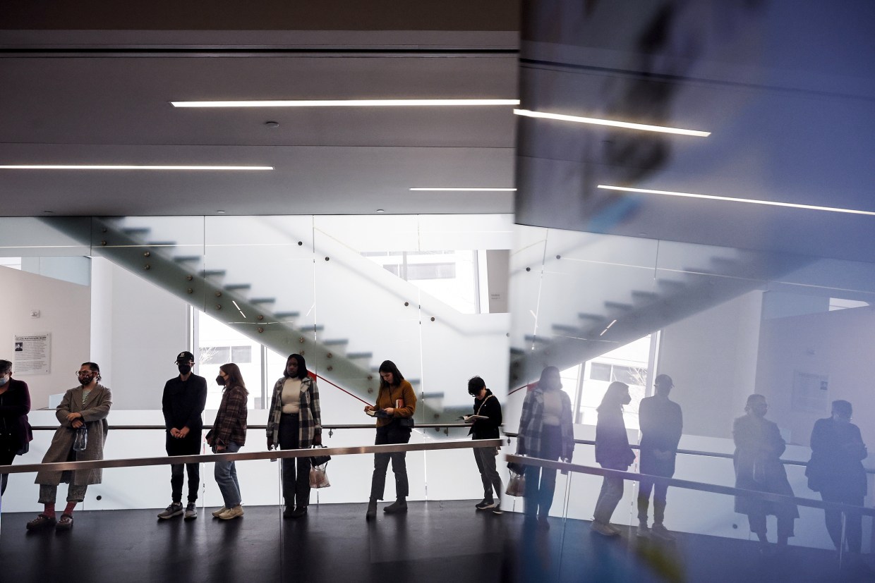 Voters wait in line on Nov. 6, 2022, in Milwaukee.