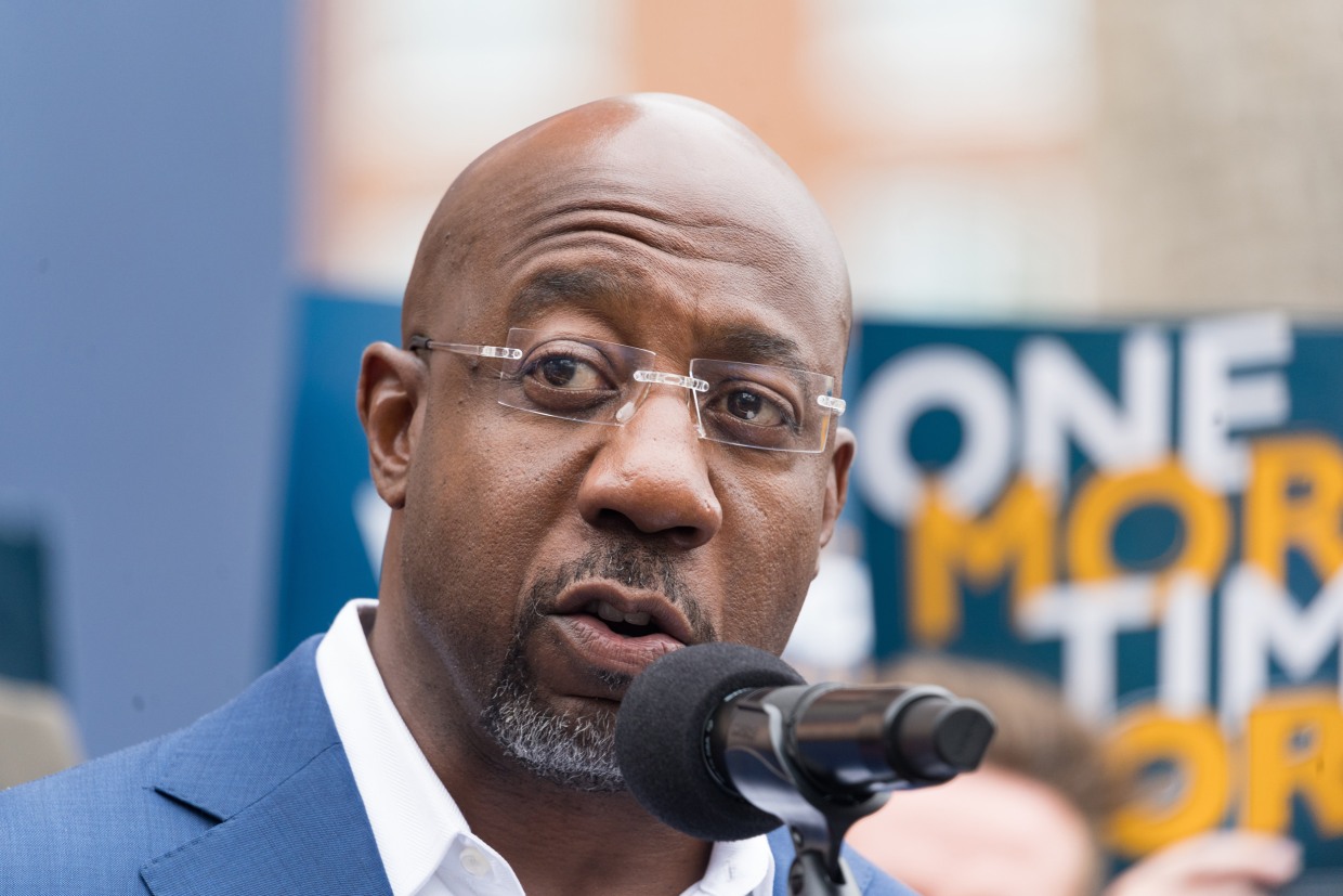 Sen. Raphael Warnock speaks at a press conference in Atlanta