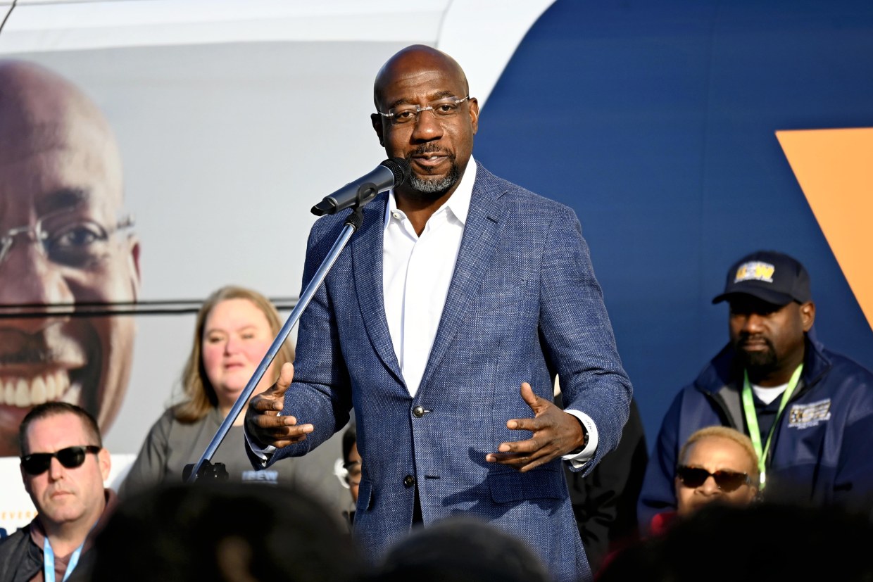 Raphael Warnock speaks at a campaign rally in Atlanta