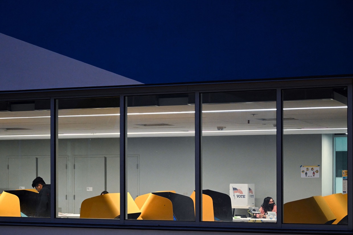People cast ballots during early voting ahead of Election Day in Los Angeles.