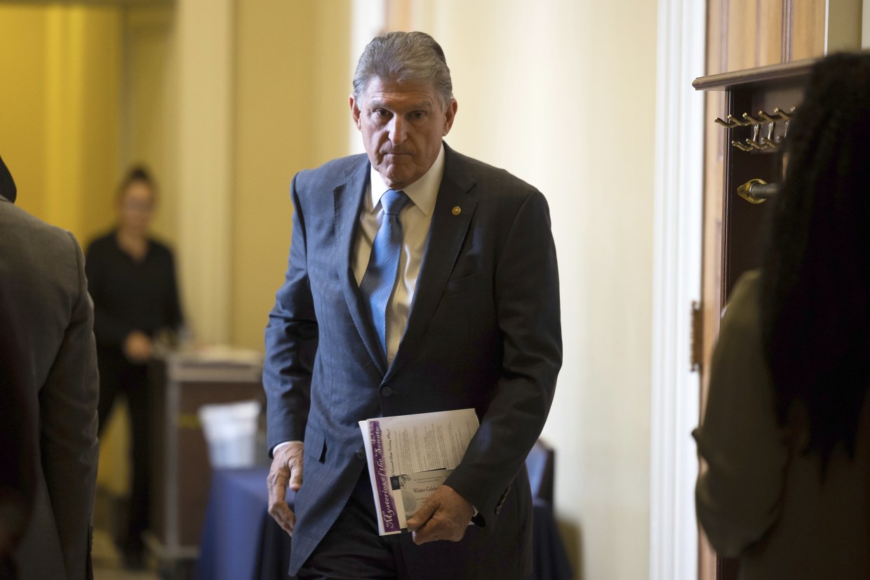 Joe Manchin departs a Senate Democratic Caucus policy luncheon at the U.S. Capitol