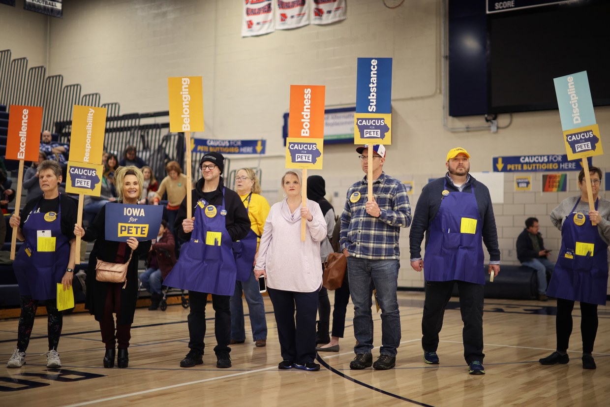 Supporters of Democratic presidential candidate Pete Buttigieg prepare to caucus for him in Des Moines, Iowa, on Feb. 3, 2020. 