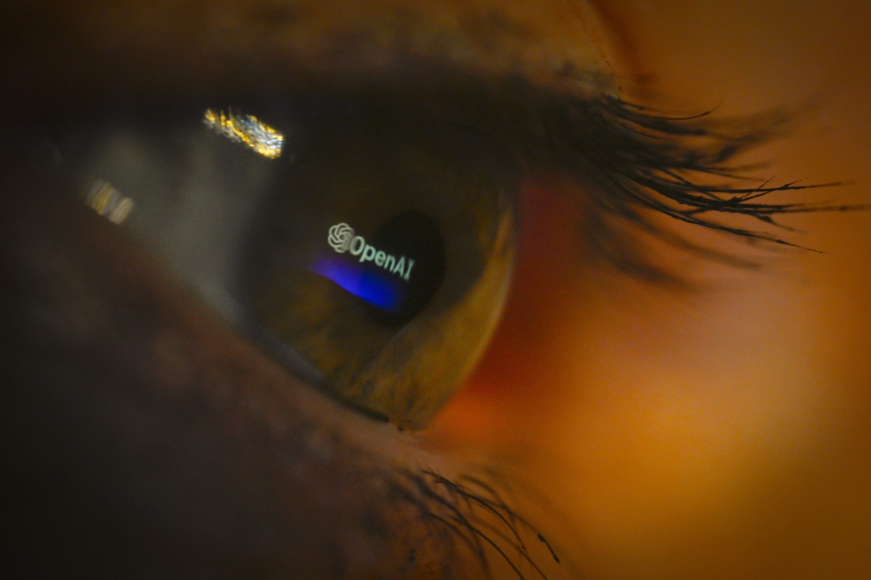 The OpenAI logo reflected in an eye.
