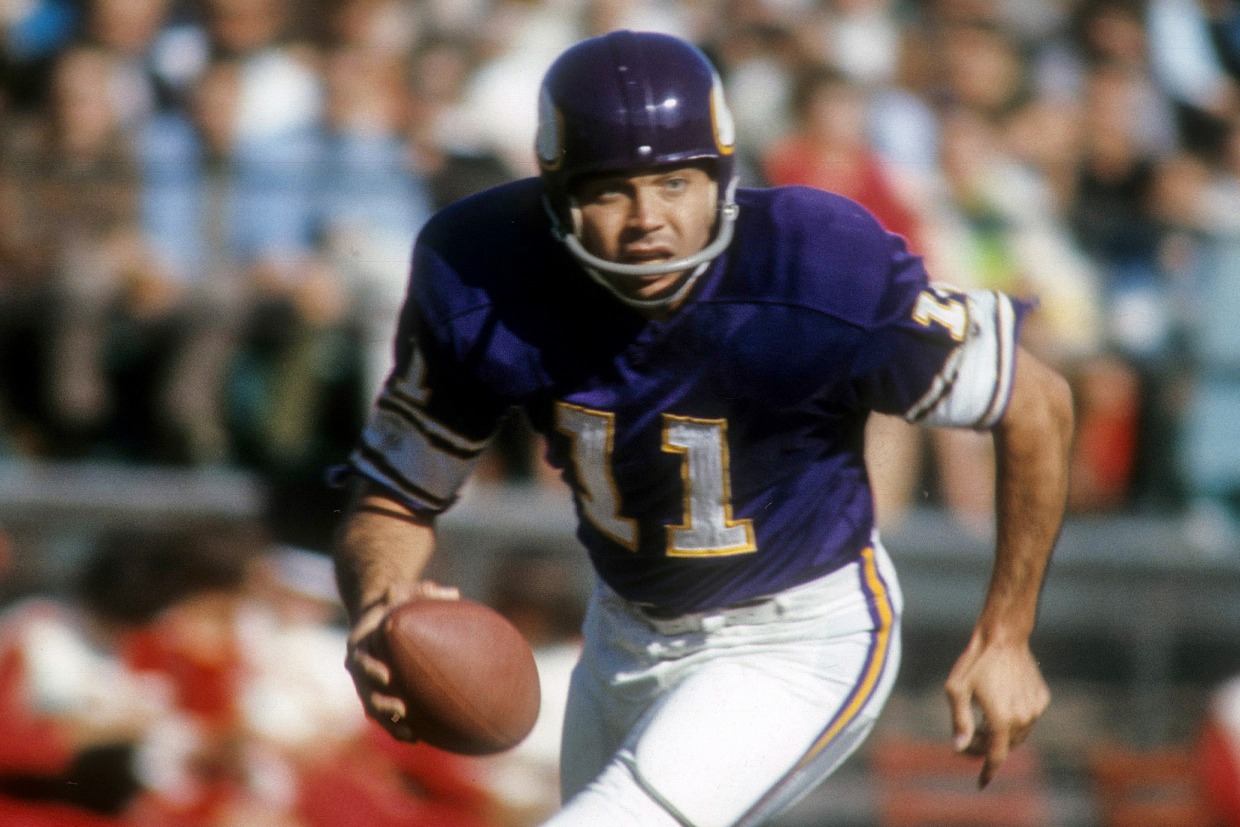 Minnesota Vikings quarterback Joe Kapp (11) raises left arm and readies the  ball with his right to get off a second-quarter pass in the NFL  Championship Game in Minneapolis, on Jan. 4