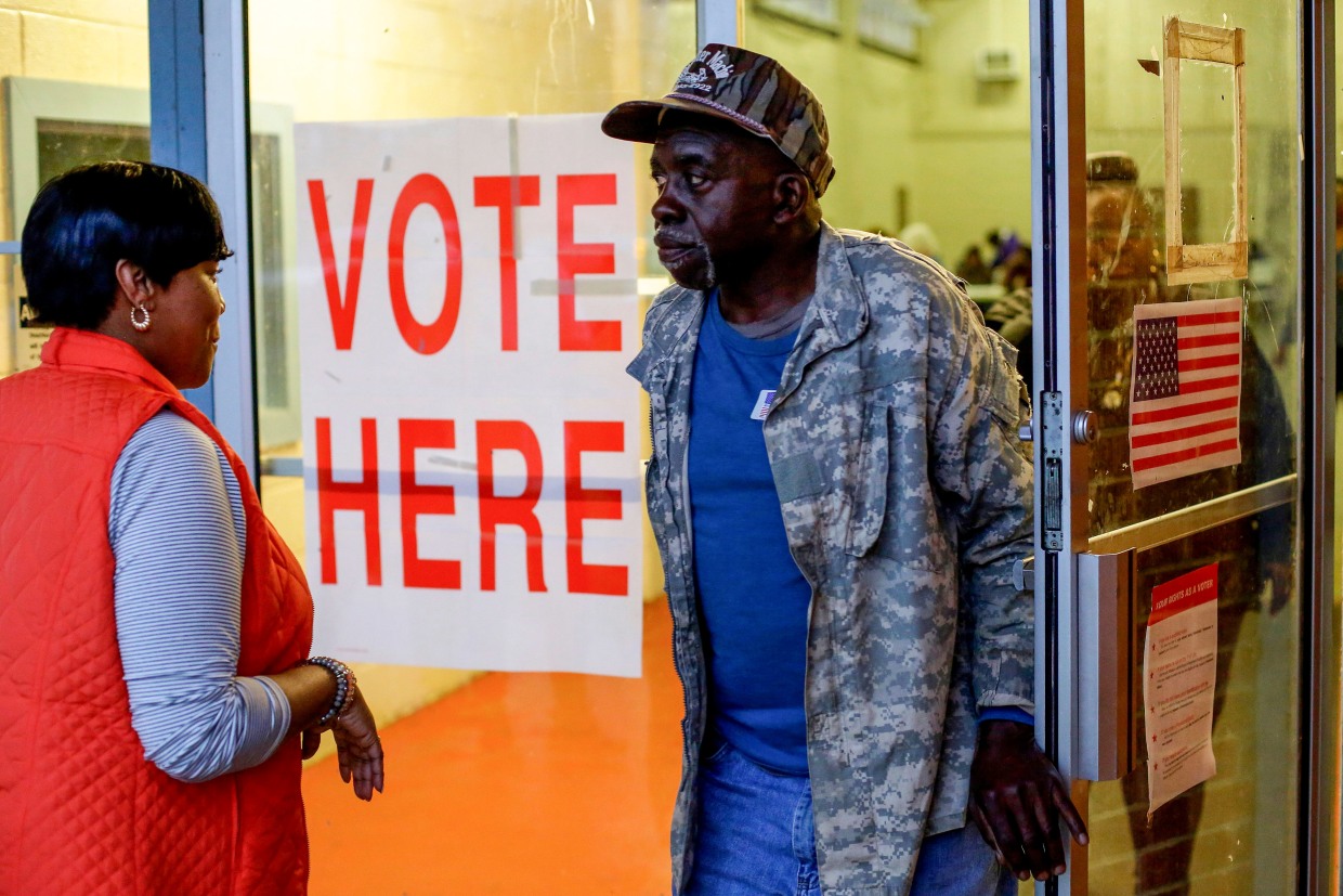 Voters exit a polling station in Camden, Ala., on March 3, 2020.