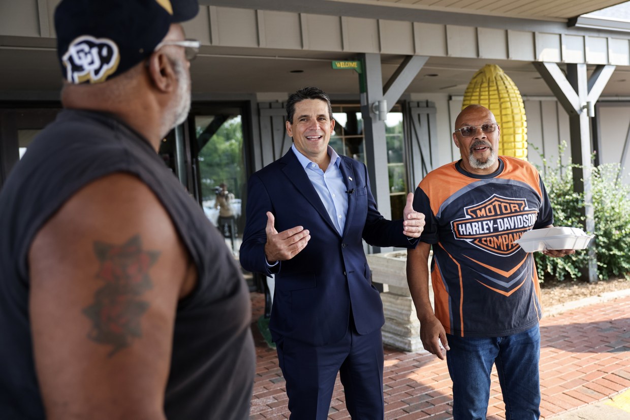 Republican presidential candidate businessman and pastor Ryan Binkley greets people in Urbandale, Iowa on July 15, 2023. 