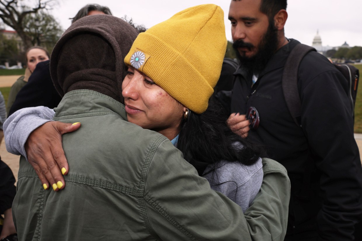 Kimberly Mata-Rubio, hugs an activist.