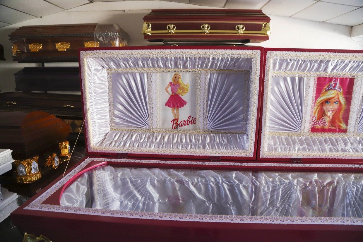 Pink coffins and Barbie liners in El Salvador funeral home