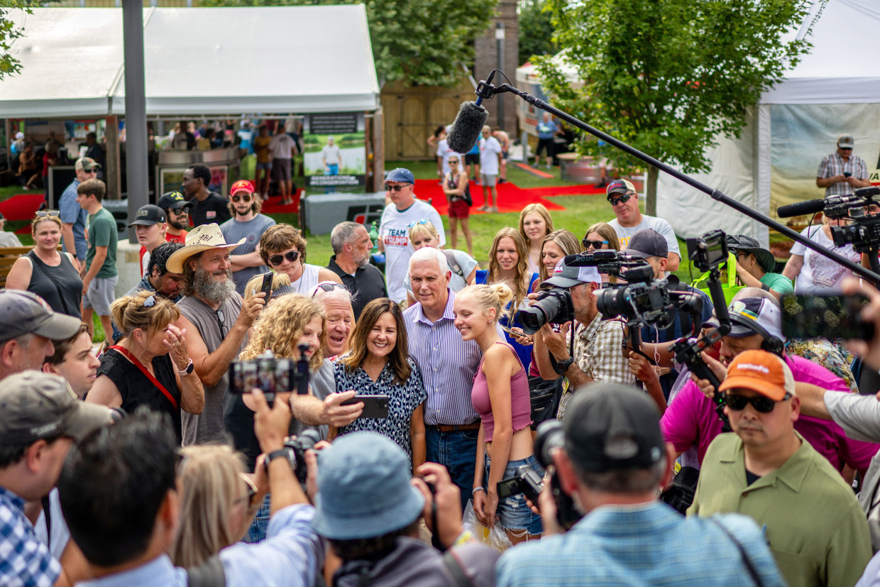 Republican presidential candidate former Vice President Mike Pence and his wife Karen greet supporters upon arrival at the Iowa State Fair on August 10, 2023 in Des Moines, Iowa. Republican and Democratic presidential hopefuls, including Florida Gov. Ron DeSantis, and former President Donald Trump are expected to visit the fair, a tradition in one of the first states to hold caucuses in 2024.