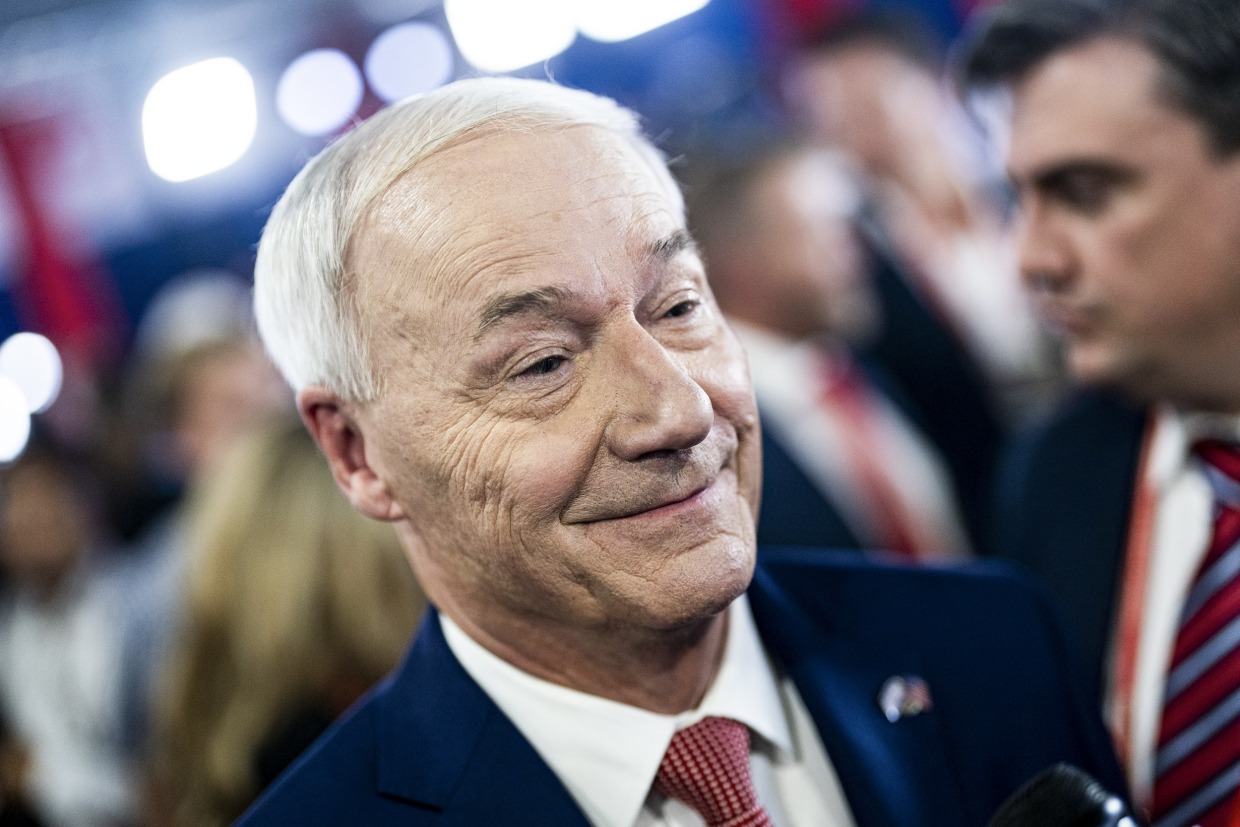 Asa Hutchinson, former governor of Arkansas and 2024 Republican presidential candidate speaks with reporters following the Republican primary presidential debate in Milwaukee, Wisc. on Aug. 23, 2023.