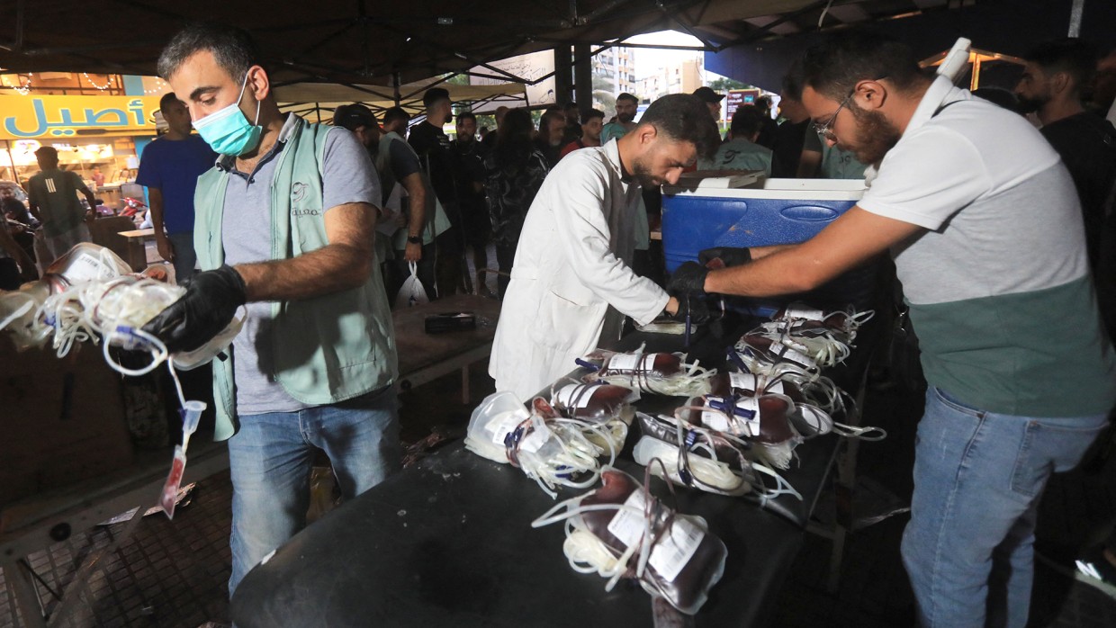 Medics collect blood donations in Beirut on Tuesday.