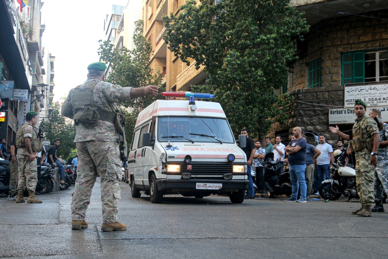 Soldiers secure the area for an ambulance to enter the American University hospital in Beirut on Tuesday.