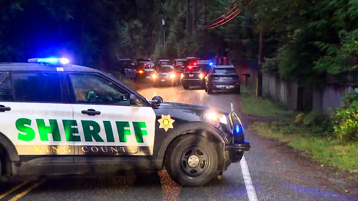 Police cars are shown in Fall City, Washington.