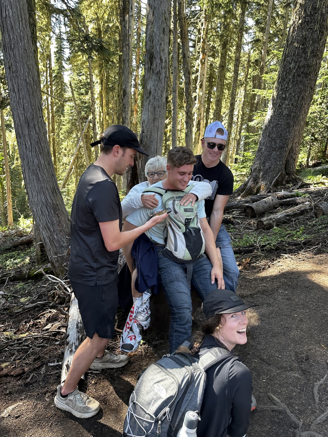 Airman Troy May and a group of kind strangers carried 79-year-old Ursula Bannister down High Rock Lookout Trail in Washington, after she broke her leg on a hike.