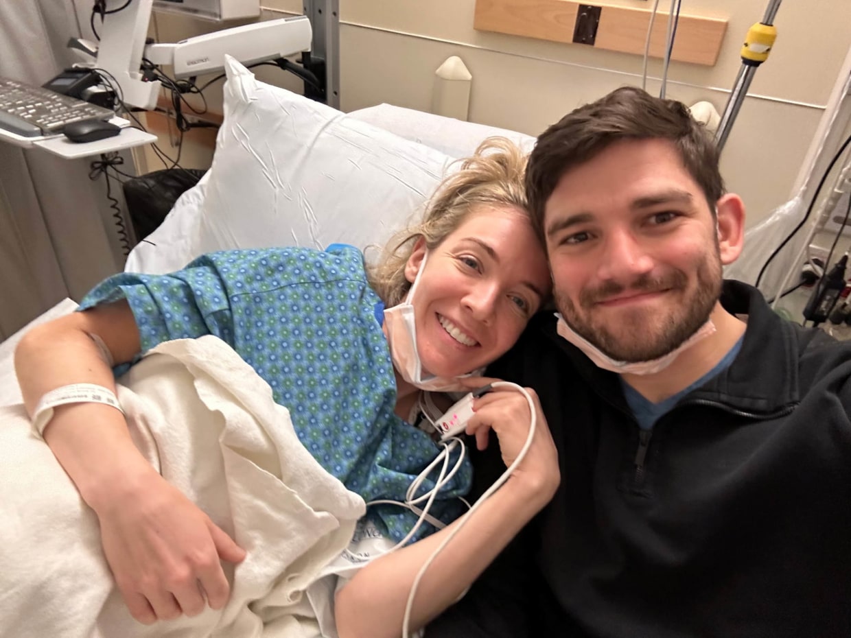 Dutton in the hospital with her partner, Drew Thompson.