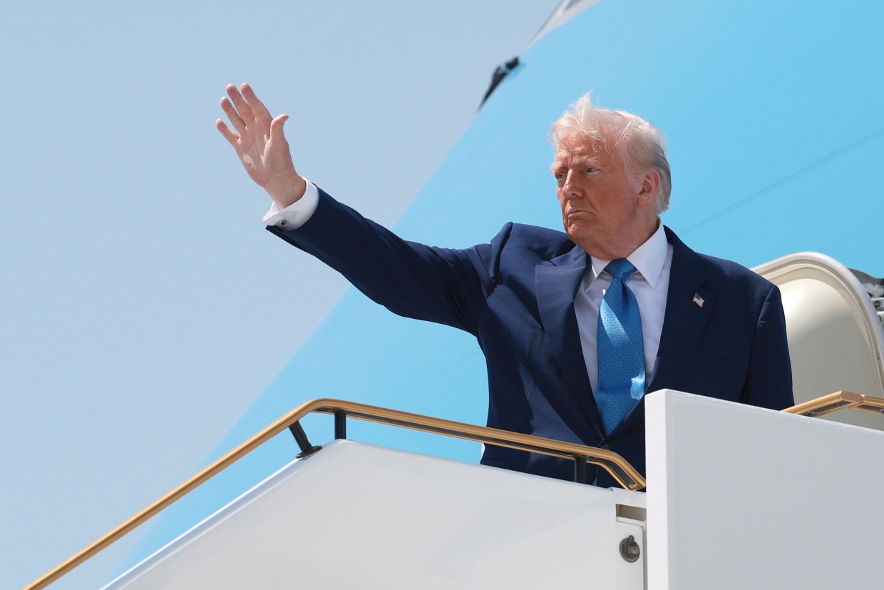 President Donald Trump boards Air Force One as he departs the Al Bateen Executive Airport, in Abu Dhabi, United Arab Emirates, on Thursday.