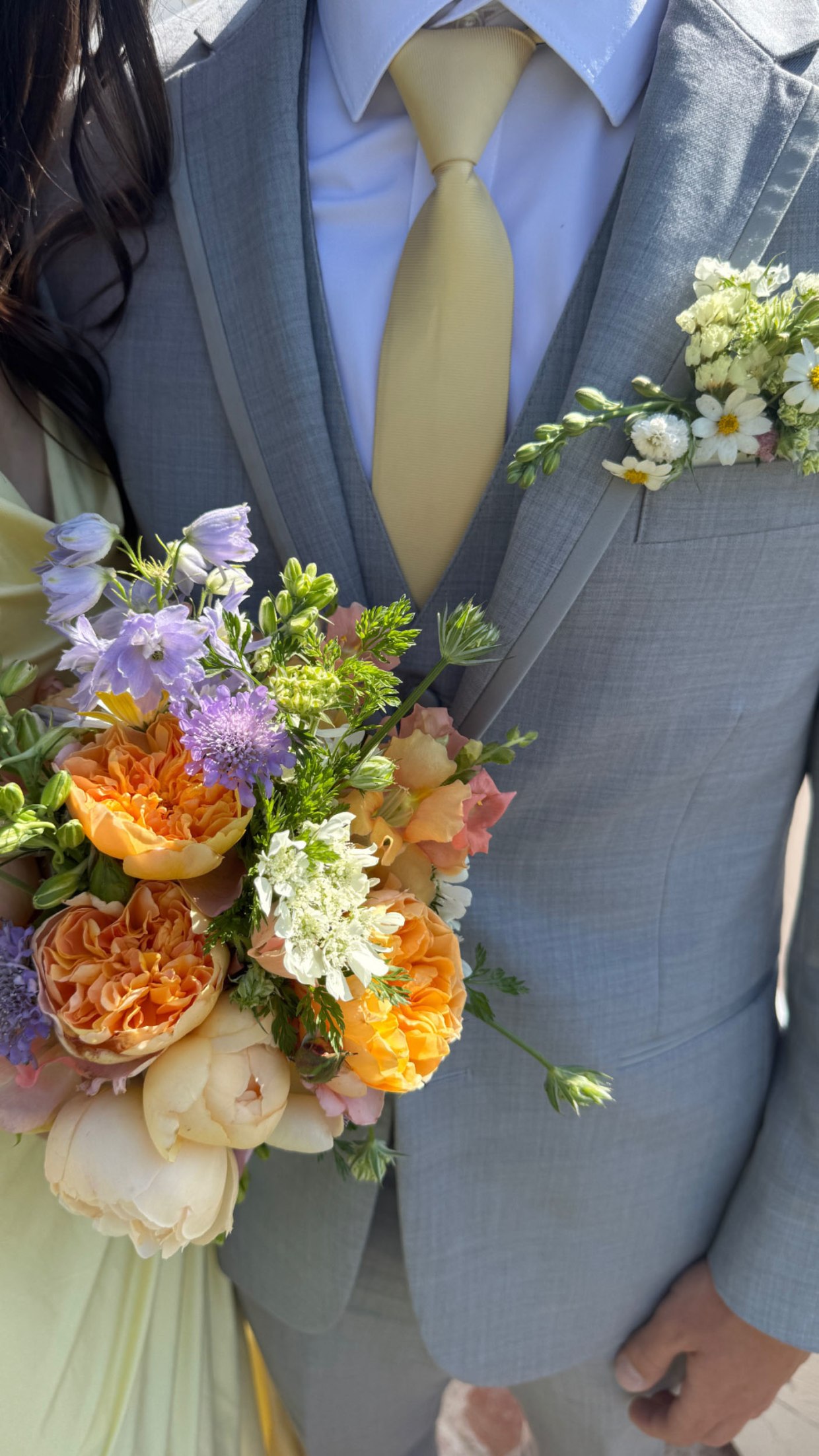 Ella posed for prom alongside her date, who coordinated his tie to match her yellow dress.