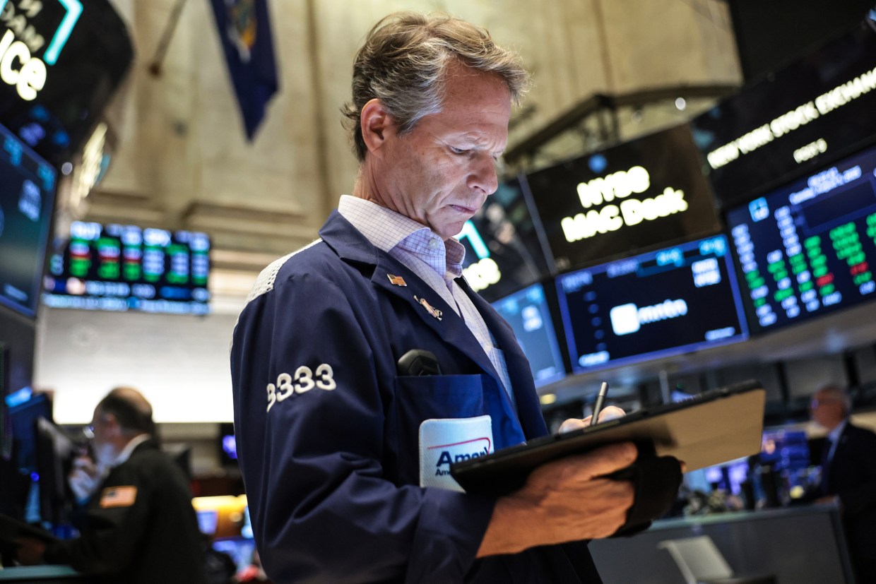 Wall Street gains as oil ends lower in volatile trade