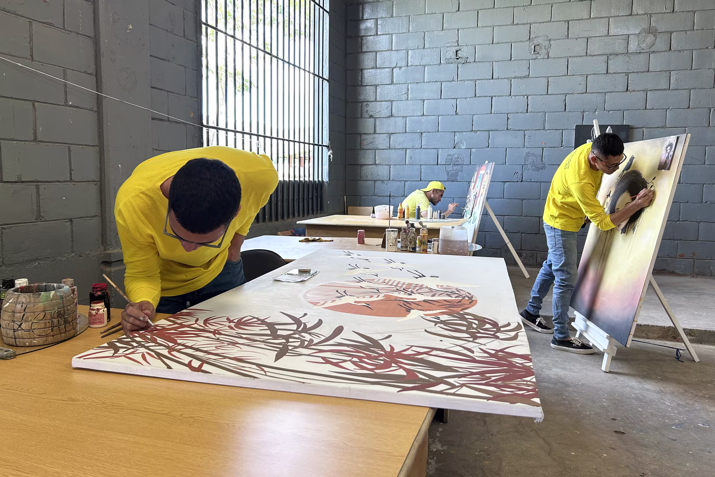Inmates paint in Centro Industrial prison in Santa Ana, El Salvador.