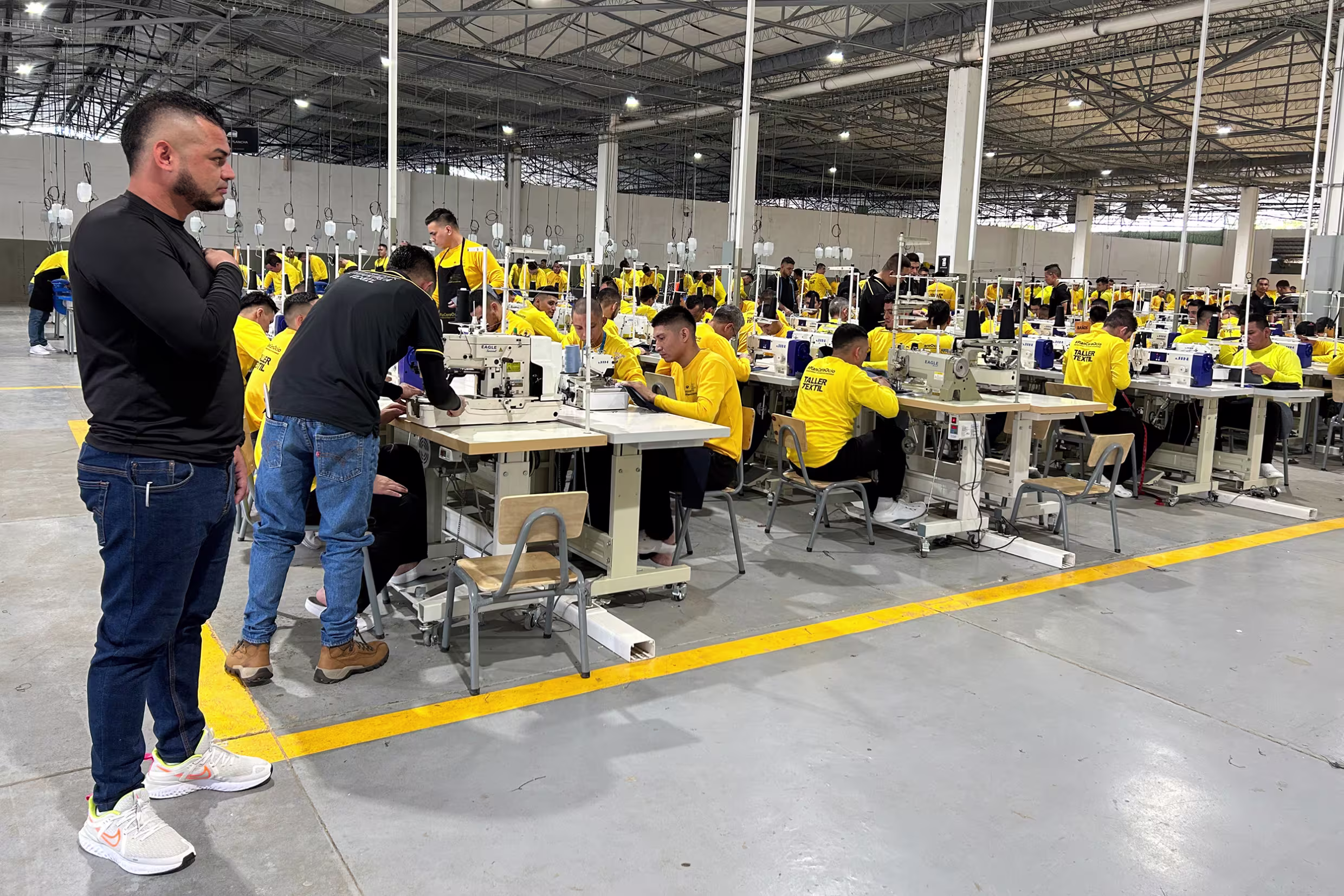 Inmates use sewing machines in Centro Industrial prison in Santa Ana, El Salvador, in April 2025.