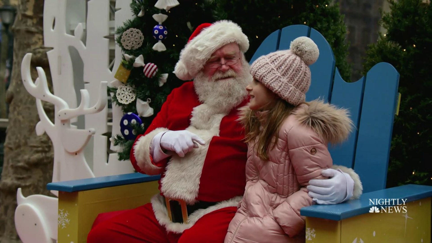 Children and Santa Claus reflect on the meaning of Christmas