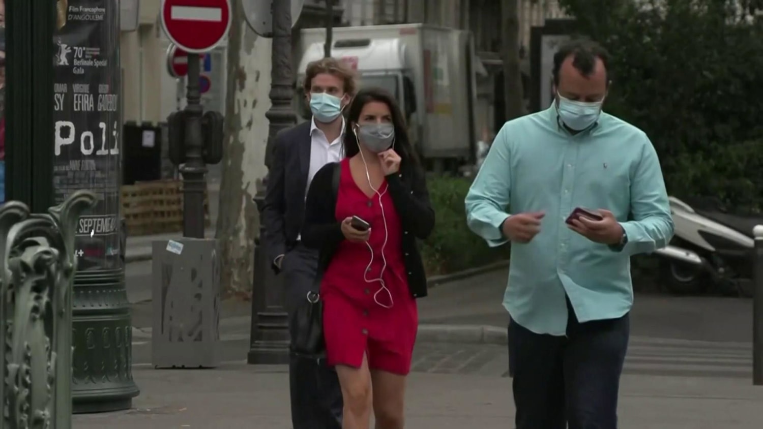 Paris. 11th May, 2020. Customers wearing protective face masks queue outside  the Louis Vuitton store before its reopening on the Champs Elysee avenue in  Paris, France on May 11, 2020. France started