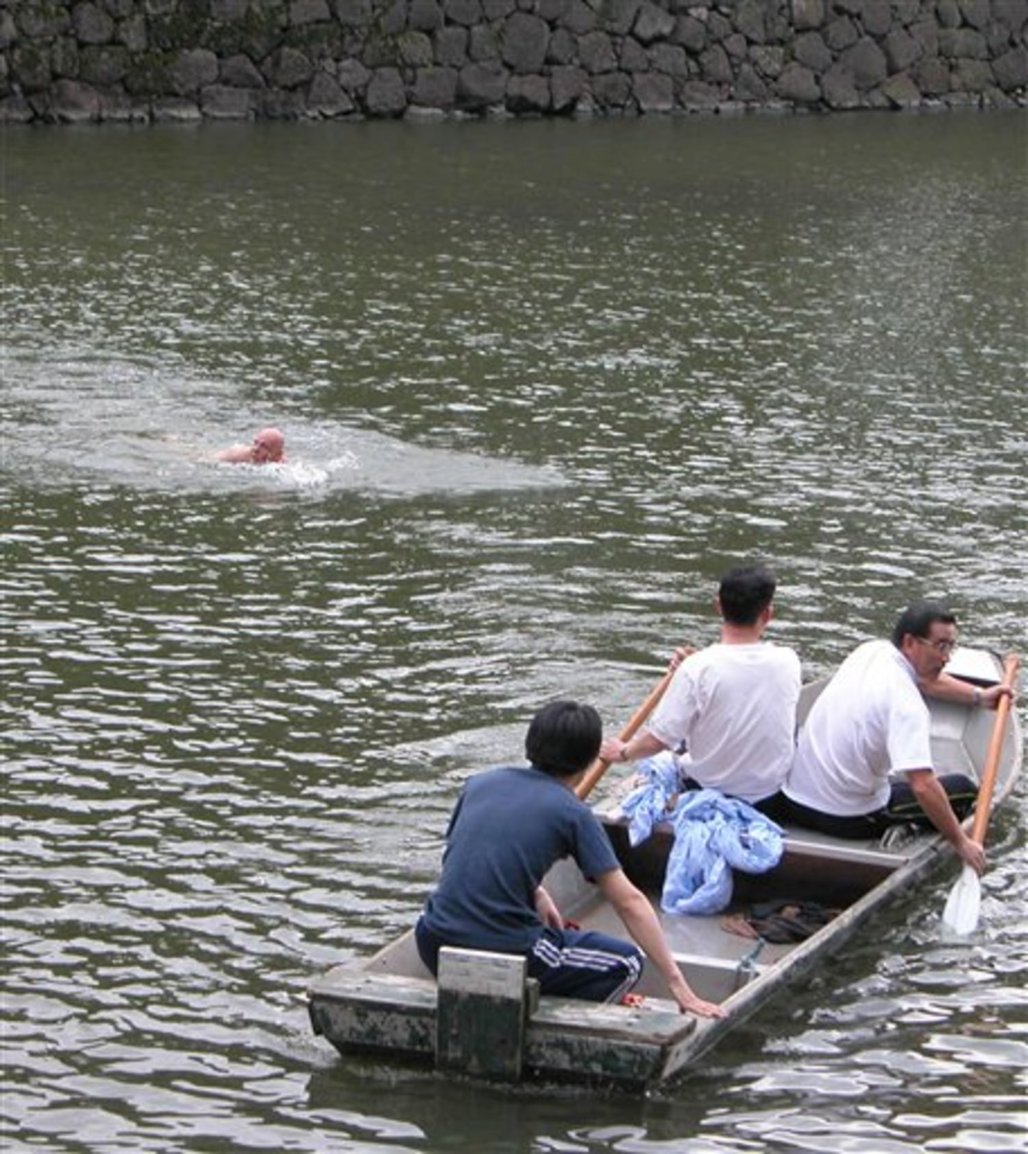 Naked man swims in Japan palace moat