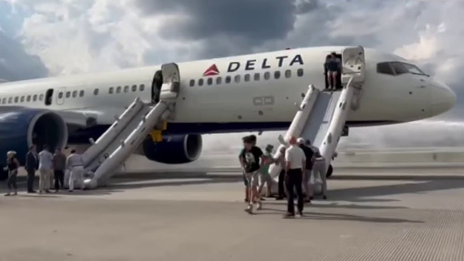 Delta passengers evacuate plane after tires blow out during landing