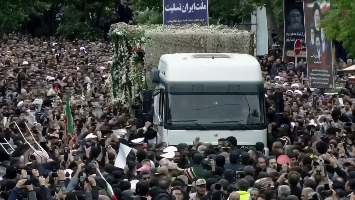 Mourners surround truck carrying remains of Iranian president – NBC News