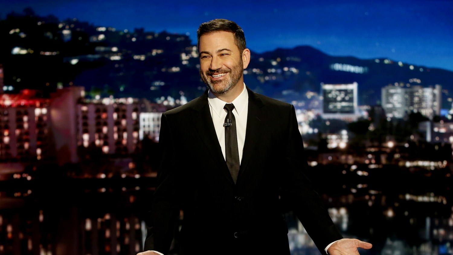 Jimmy Kimmel seeks to smooth tensions and takes aim at Trump in first show since ABC suspension