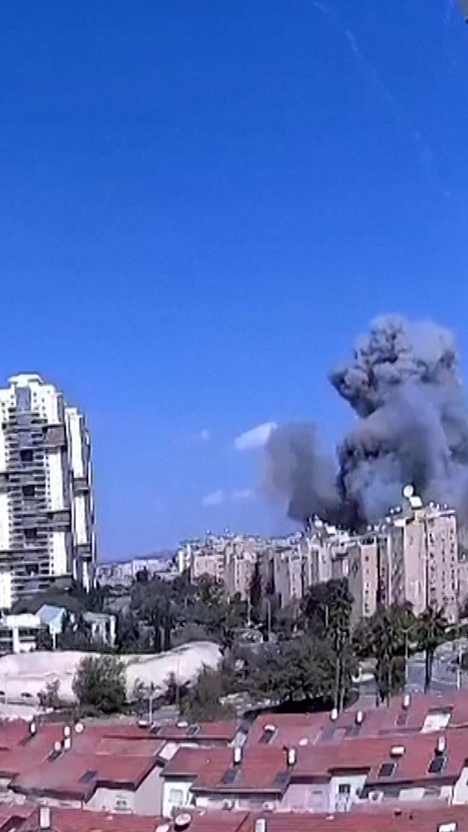 Video shows Iranian missile strike building in Israel