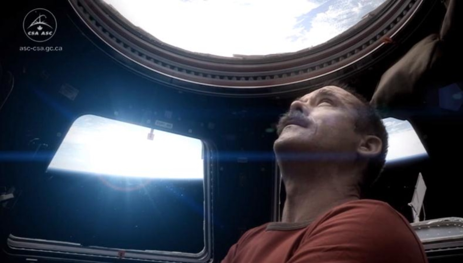 The stars different today': Astronaut Chris Hadfield films Bowie cover video in space