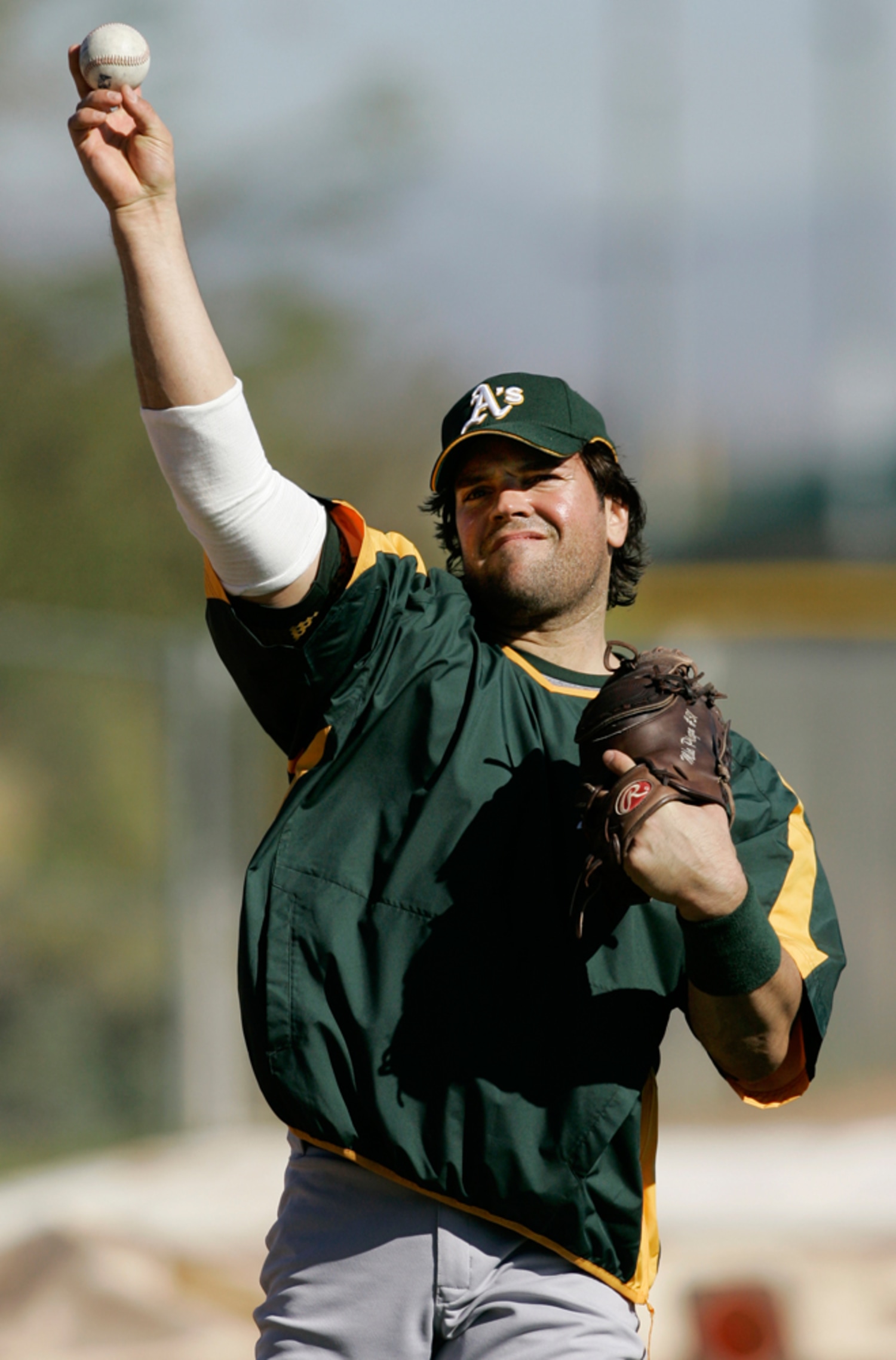 World Baseball Classic series Italian team catcher Mike Piazza winds up for  a throw during a team workout, in Lakeland, Fla., Friday, March 3, 2006.  The series involving teams from around the
